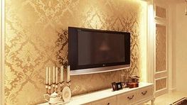 Expertly installed wallpaper on a room with a wall mounted television