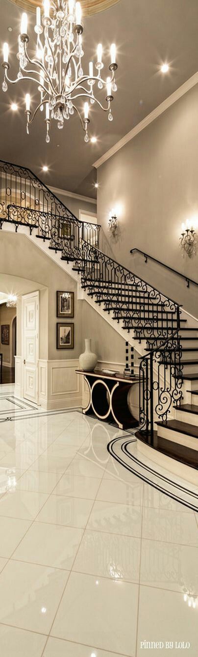 A large ornate hallway painted a cream grey