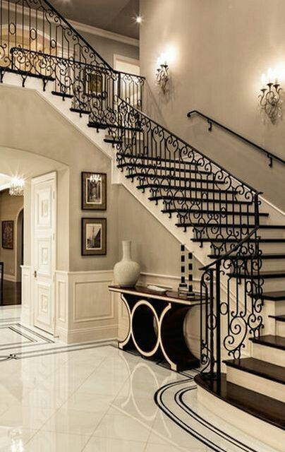 A large ornate hallway painted a cream grey